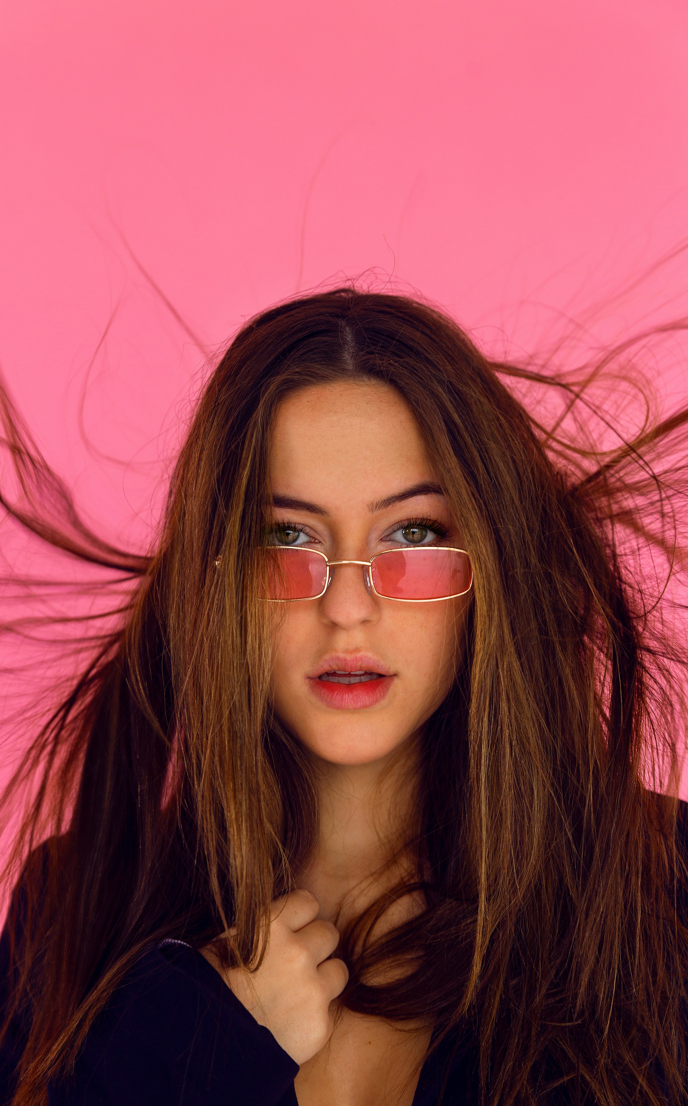 Woman wearing bold fashion optical frames