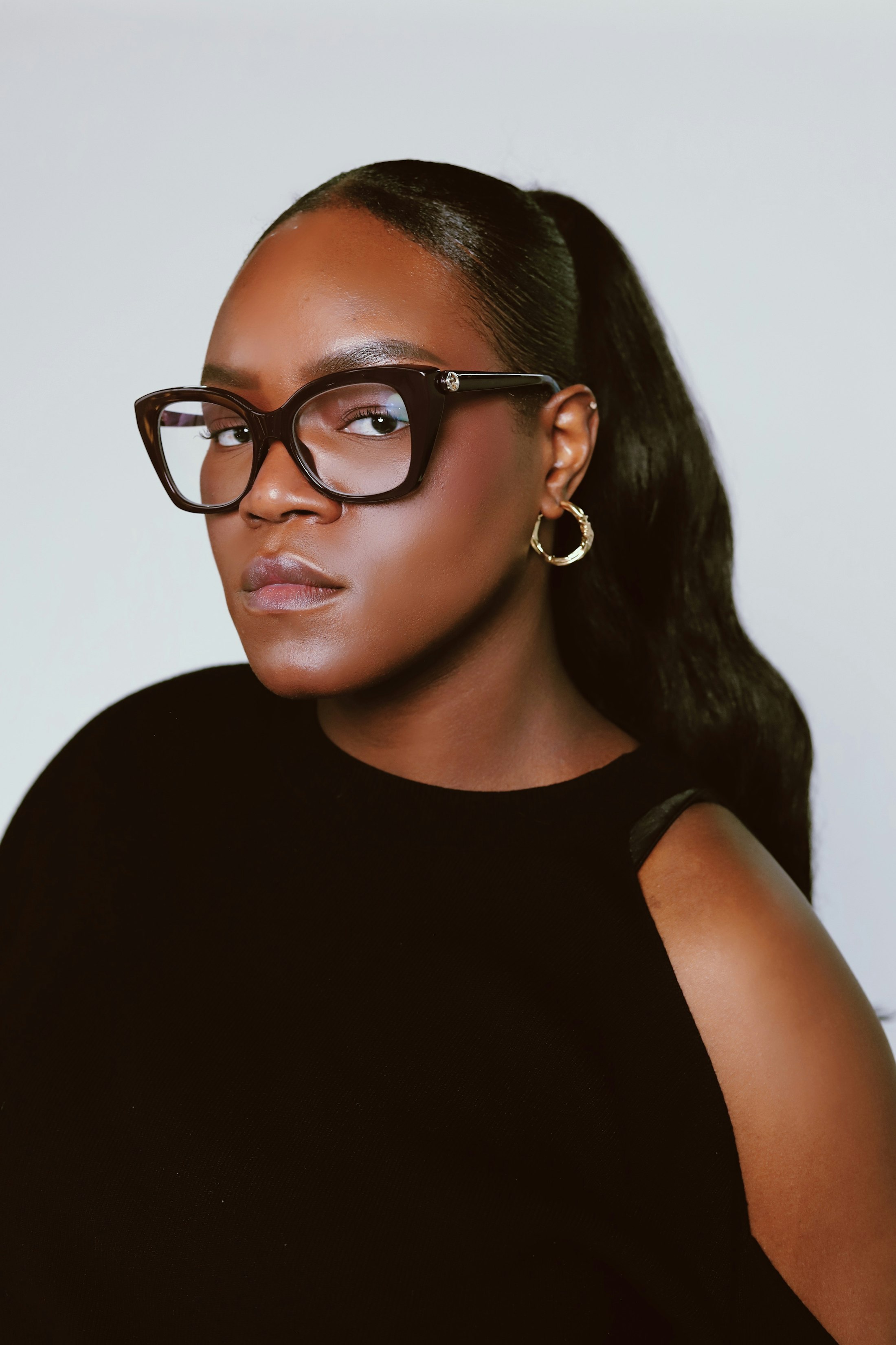 Model wearing oversized black optical frames