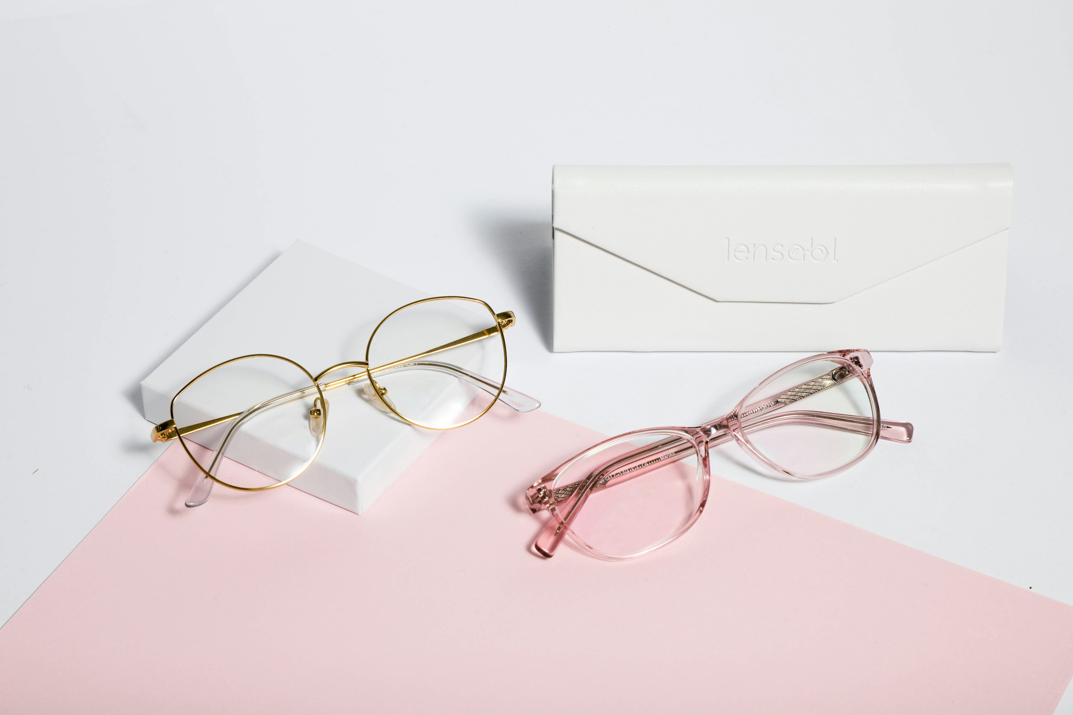 Gold optical frames resting on paper