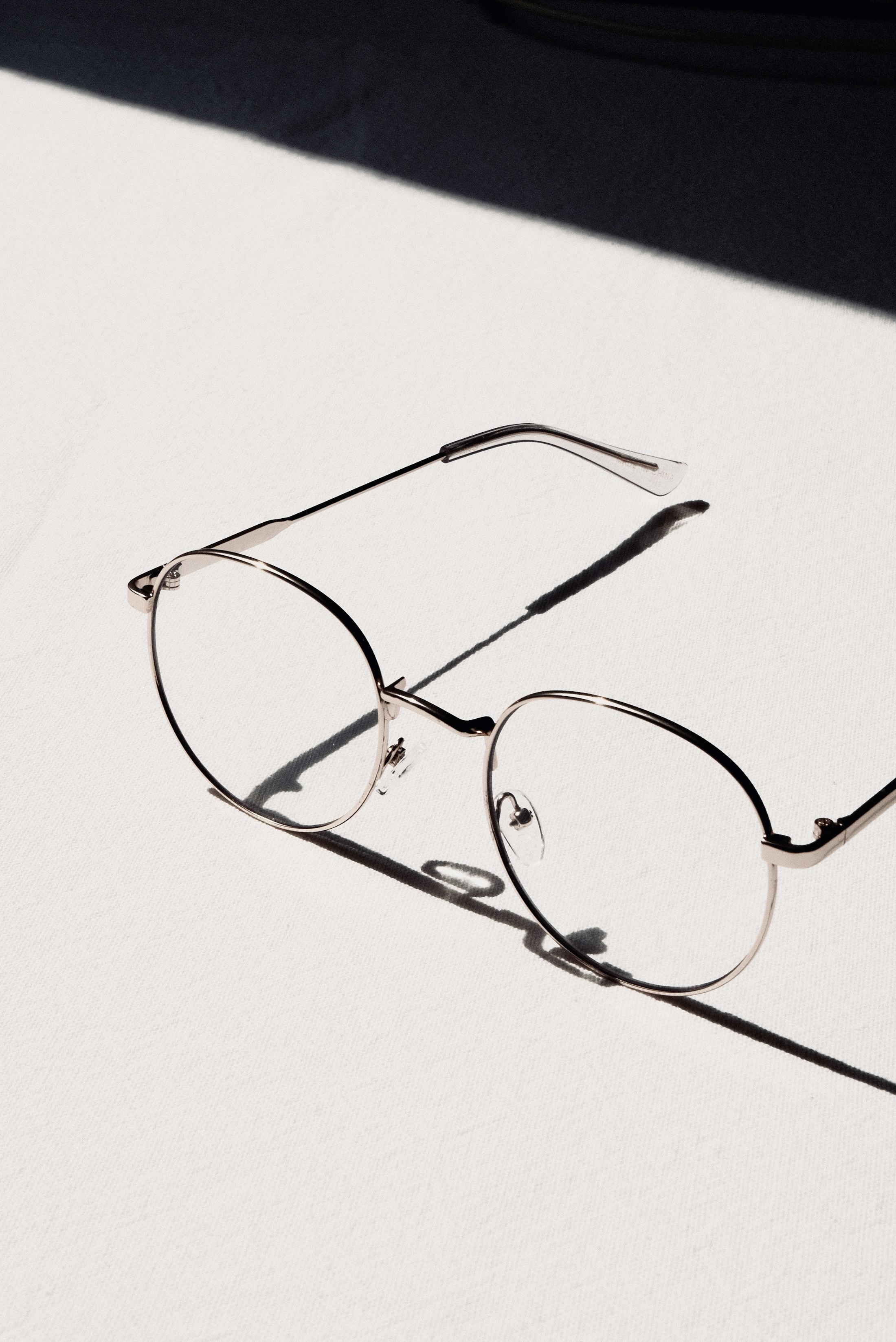 Silver optical frames on a white table